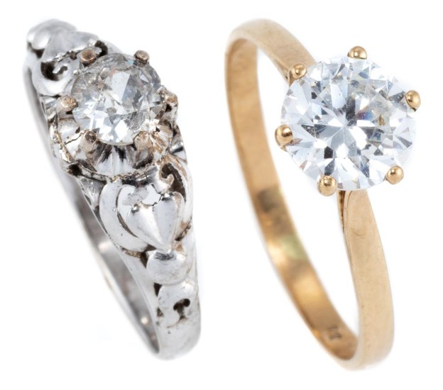 TWO 9CT GOLD STONE SET RINGS; 1 in white gold set with an approx. 0.35ct round brilliant cut diamond (chipped girdle) size L1/2, oth...