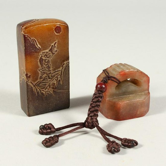 TWO CARVED SOAPSTONE SEALS.
