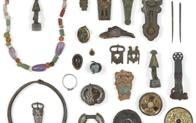 The Anglo-Saxon Ozengell Hoard An important collection of approximately 1,700 Anglo-Saxon artefacts Circa 6th-7th Century A.D. Including: Jewellery and glass: Including: a gilt-silver disc brooch, the centre set with a white stone or paste disc...