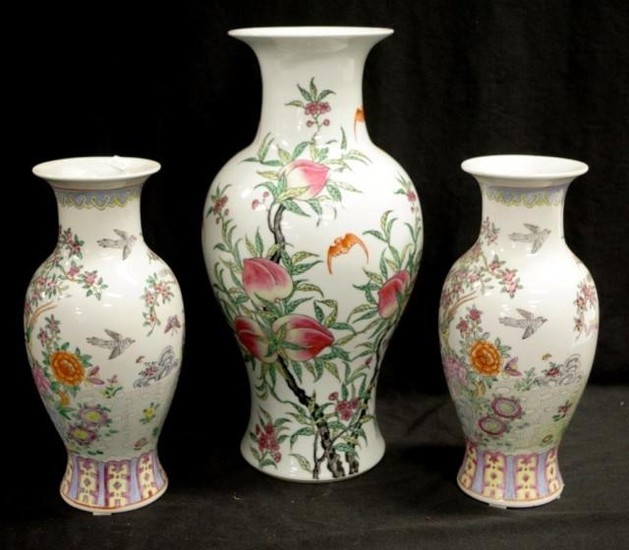 Three Chinese famille rose ceramic vases including a pair, b...