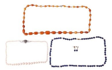Three beaded necklaces and a pair of matching earrings; to include an amber bead necklace with a ser