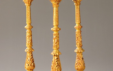 Three candlesticks, baroque style, carved and gilded wood, loose candle...