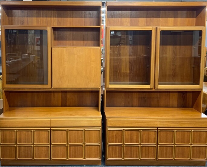 Two 1970's teak display cabinets, one incorporating a drop down bar, each is 120 x 193cm.