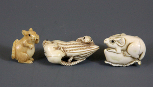 Two earloy 20thC carved ivory netsukes and a small carved ivory squirrel, Largest H. 4.4cm. (Prov. Samy collection)