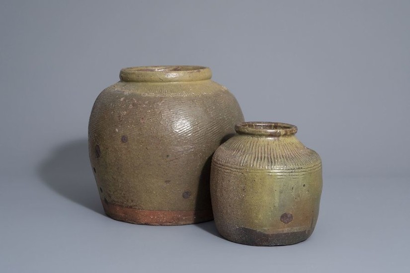 Two green brown storage jars, South East Asia,...