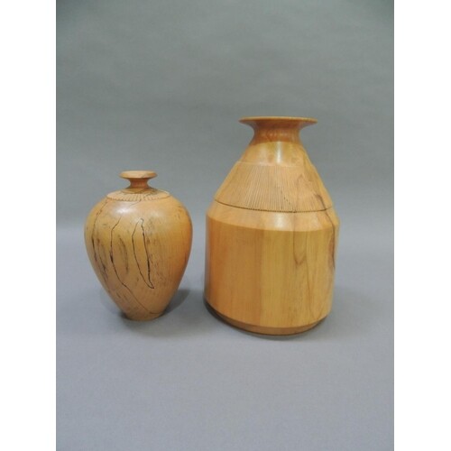 Two spalted beech turned vases, of ovoid form with fluted co...