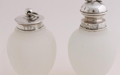 Two tea canisters with silver caps