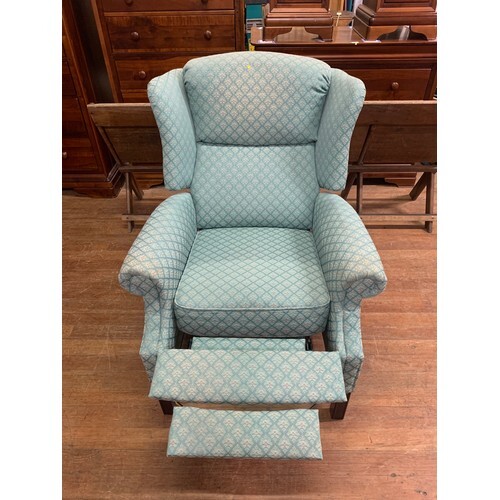 Upholstered wingback, reclining armchair.