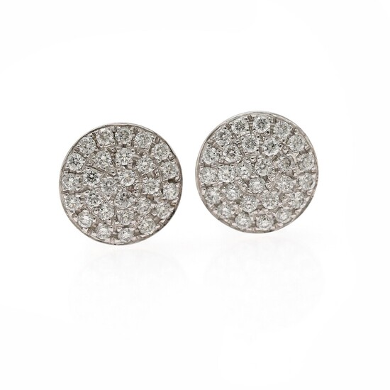 Wallin Jewels: A pair of diamond ear studs each set with numerous diamonds weighing a total of app. 0.65 ct., mounted in 18k white gold. D-F/VVS-VS.