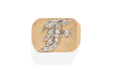 a gold and diamond monogram ring