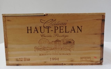 12 bouteilles de Château Haut Pélan. Cuvée Prestige. 1994. Côtes de Francs. Caisse bois.