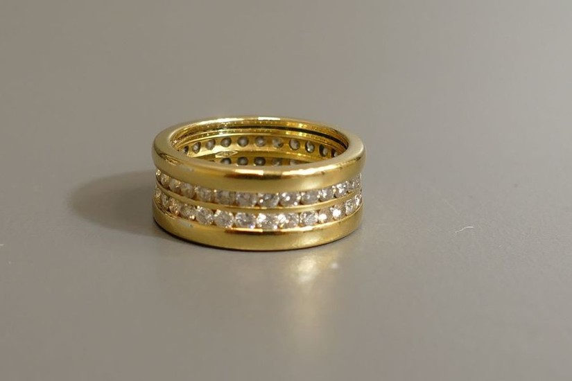 18 karat yellow gold ring set with diamonds...