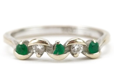18ct white gold diamond and emerald five stone crossover rin...