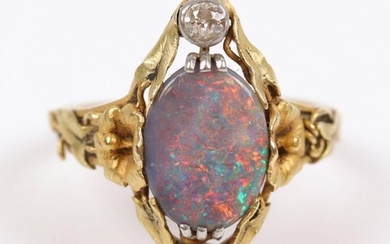 2 Gold rings (750) opal center. T: 56/59, Weight: 8.3 gr. One Art Nouveau period, by DELURET