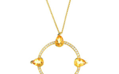 An 18ct gold citrine and diamond compass pendant. View more details