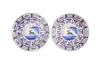 29-Delft: a pair of polychrome earthenware plates representing a capridé...