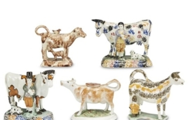 Assembled group of five pearlware and Prattware cow figures...