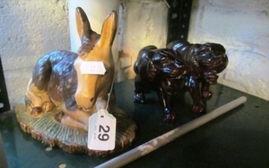 A ceramic donkey and pair treen lions
