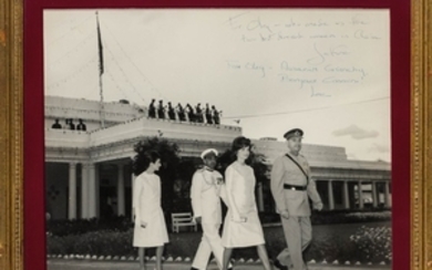 KENNEDY, JACQUELINE as FIRST LADY and RADZIWILL, LEE Double inscribed photograph to Oleg Cassini of the First Lady and Radziwill leaving the Governor's House at Peshawar, Pakistan, 1962.