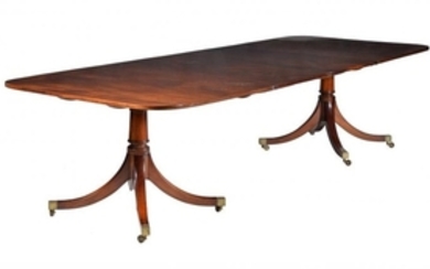 A mahogany twin pillar dining table in late George III style