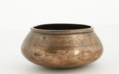 A Middle Eastern engraved copper bowl