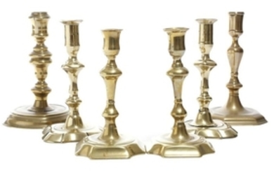 Two pairs of George II brass candlesticks, each wi…