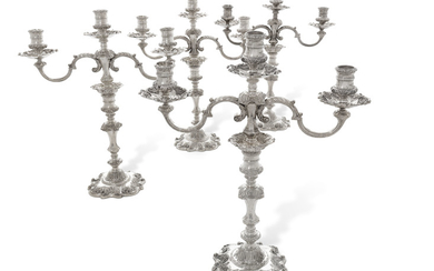 TWO PAIRS OF ELIZABETH II SILVER THREE-LIGHT CANDELABRA, MARK OF GARRARD AND COMPANY LIMITED, LONDON, 1973 AND 1979