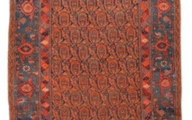 ORIENTAL RUG: FERAGHAN 4'7" x 6'7" Several rows of boteh rendered in red, blue and green cross a midnight blue field bounded by a br.