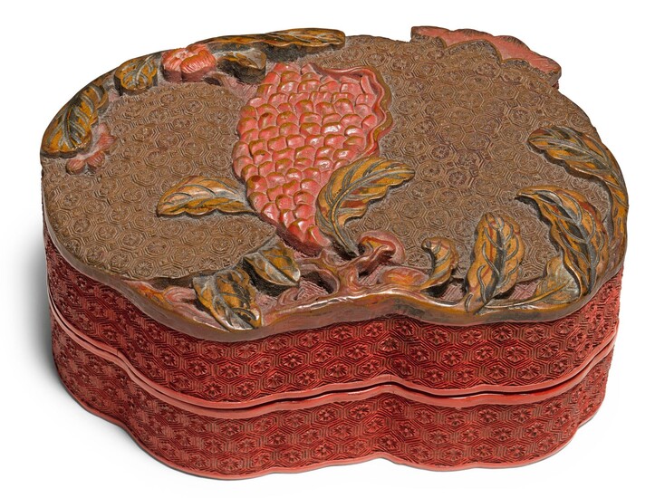 A CARVED POLYCHROME LACQUER 'POMEGRANATE' BOX AND COVER QING DYNASTY, QIANLONG PERIOD