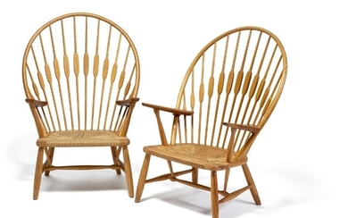Hans J. Wegner: “Peacock Chair”. A pair of easy chairs with ash frame and teak armrests. Seats with woven paper cord. (2)