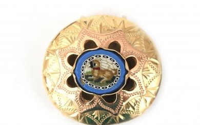 A 14 karat gold micro mosaic pendant. Depited is a smal dog in an elaborate frame of rose and yellow gold. Gross weight: 6.8 g.