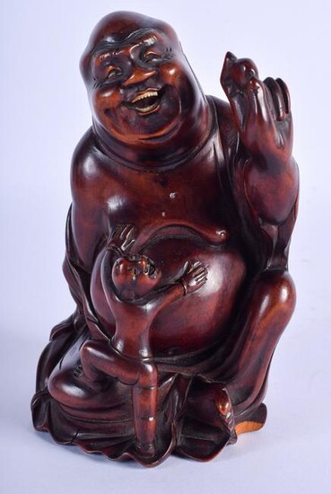 A 19TH CENTURY CHINESE CARVED HARDWOOD FIGURE OF A