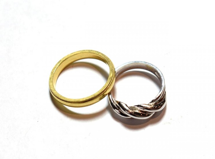 A 9 carat white gold twist ring, finger size L;...