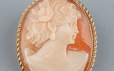A 9ct gold and shell cameo brooch, carved depicting the port...