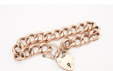 A 9ct gold large curb link bracelet, with love heart locket.
