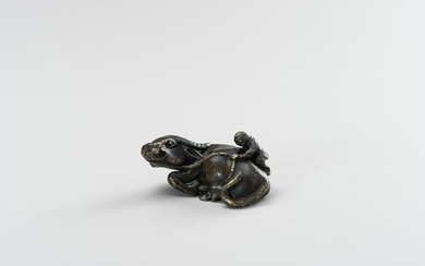 A BRONZE PAPERWEIGHT OF A WATER BUFFALO AND HERDER