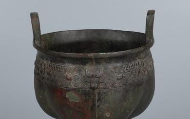 A CHINESE BRONZE 'TAOTIE' TRIPOD DING VESSEL