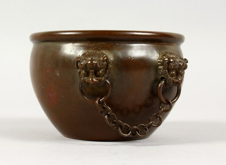A CHINESE CIRCULAR BRONZE CENSER, with four mask