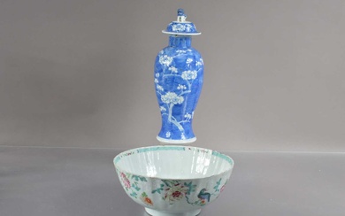 A Chinese Qin dynasty famille rose bowl with fluted sides decorated with birds and peonies
