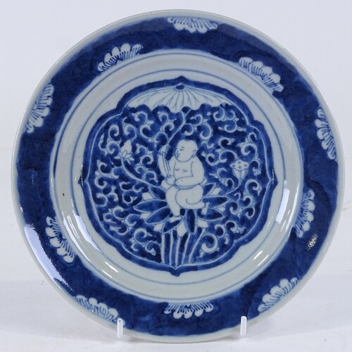 A Chinese blue and white porcelain plate, with painted Buddh...