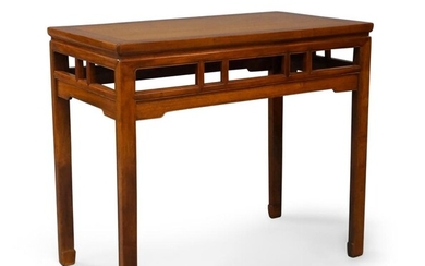 A Chinese rosewood table, 20th century, the top composed of two panels set into a rectangular frame, supported by four square legs terminating in tapered feet and connected by stretchers joined by four vertical struts on the long sides and two on...