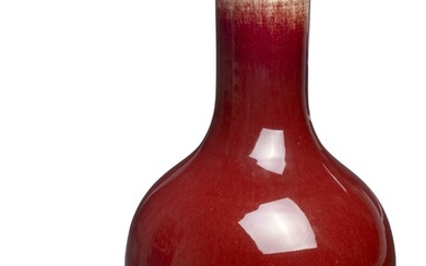 A Chinese sang de boeuf porcelain bottle vase. 19th century. H. 38 cm.