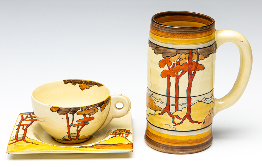 A Clarice Cliff bizarre cup and saucer together with a...