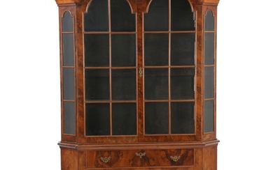 A Dutch Baroque style double dome display cabinet. 19th century. H. 215 cm. W. 140 cm. D. 28 cm.