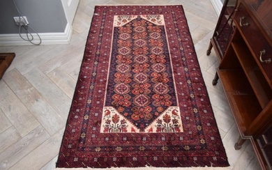 A FINELY HAND-KNOTTED TRIBAL PERSIAN BALOUCH RUG. 100% WOOL PILE. IN MAGNIFICENT CONDITION. TRIBAL BALOUCH WEAVE FROM THE KHORASAN P...