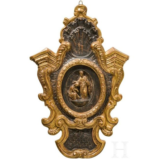 A French carved and partly gilded relief plate, 18th