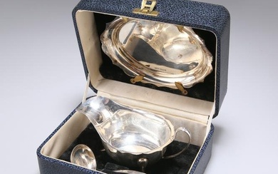 A GEORGE VI SILVER SAUCEBOAT, LADLE AND STAND
