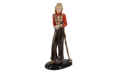 A GOLDSCHEIDER FIGURE OF A YOUNG WOMAN IN A SKIING OUTFIT