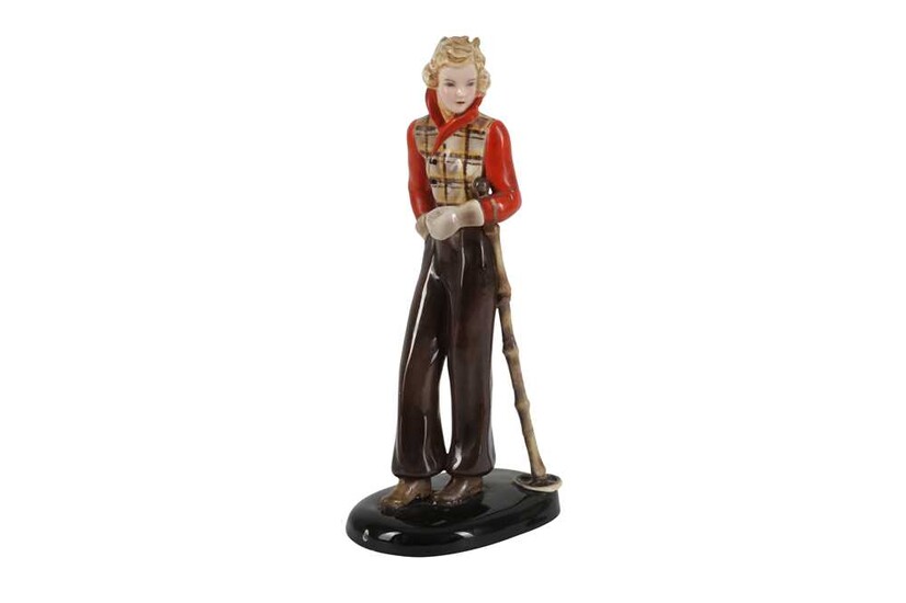 A GOLDSCHEIDER FIGURE OF A YOUNG WOMAN IN A SKIING OUTFIT