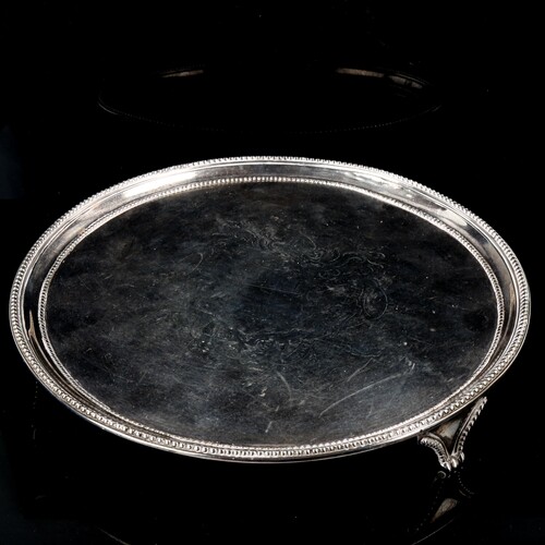 A George III circular silver salver, bead edge with engraved...